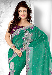 Era with extension in fashion, style, Grace and elegance have developed grand love affair with this ethnical wear. This Lehenga saree is nicely designed with Diamond, Sequins, Stone, Cut Dana, Moti, Cut Moti work in floral motifs. Saree gives you a singular and dissimilar look. This drape material is shimmer georgette. Matching blouse is available. Slight color variations are possible due to differing screen and photograph resolution.