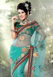 Dreamy variation on shape and forms compliment your style with tradition. This saree is nicely designed with embroidered patch work. Embroidery is done with resham, sequins and zari work in form of floral motifs. Heavy mix match embroidery patch border work on saree make attractive to impress all. Fabulous designed embroidery gives you an ethnic look and increasing your beauty. This saree gives you a modern and different look in fabulous style. This beautiful drape is crafted with net fabric. Contrasting green dupion silk blouse is available with this saree. Slight color variations are possible due to differing screen and photograph resolution.