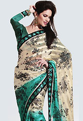 Get ready to sizzle all around you by sparkling saree. This saree is awesomely designed with satin patti with floral print work and embroidered border on all over which make symbol of elegance. Saree has nice color combination. Look stunning rich with dark shades and floral patterns. This season dazzle and shine in pure colors. It’s cool and has a very modern look to impress all. This drape material is faux georgette. Matching blouse is available. Slight Color variations are possible due to differing screen and photograph resolutions.