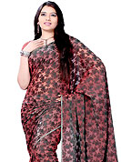 Let your personality articulate for you with this amazing embroidery saree. This maroon saree is nicely designed with embroidered work in fabulous style. Embroidery is done with resham and sequins work in form of floral motifs. This saree gives you a modern and different look in fabulous style. This beautiful drape is crafted with georgette fabric. Matching blouse is available with this saree. Slight color variations are possible due to differing screen and photograph resolution.