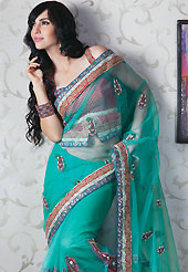 It is color this season and bright shaded suits are really something that is totally in vogue. This aqua green saree have beautiful embroidery work which is embellished with resham, zari, stone and beads work in form of floral motifs. Beautiful embroidery patch border on saree make attractive to impress all. This beautiful drape is crafted with net fabric. Matching blouse is available. Slight Color variations are possible due to differing screen and photograph resolutions.