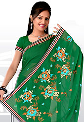 Envelope yourself in classic look with this charming saree.  This purple saree have beautiful embroidery work which is embellished with resham and zari work in form of floral motifs. Beautiful embroidery patch work border on saree make attractive to impress all. This beautiful drape is crafted with georgette fabric. Matching blouse is available. This saree is also available in red, green, pink, peach, aqua, orange, voilet colors. Slight Color variations are possible due to differing screen and photograph resolutions.