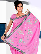 Be the cynosure of all eyes with this wonderful casual wear in flattering colors and combinations. This purple saree have beautiful embroidery work which is embellished with resham and sequins work in form of floral and paisley motifs. Beautiful embroidery patch work border on saree make attractive to impress all. This beautiful drape is crafted with georgette fabric. Matching blouse is available. This saree is also available in red, green, pink, peach, aqua, orange, voilet colors. Slight Color variations are possible due to differing screen and photograph resolutions.
