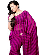 Take a look on the changing fashion of the season. This saree is beautifully designed with stripe print work. This fabulous party wear saree is specially crafted for your stunning and gorgeous look. This beautiful drape is crafted with georgette fabric. Matching Blouse is available with this saree. Slight Color variations are possible due to differing screen and photograph resolutions.