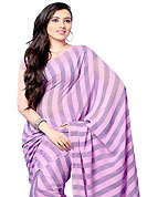 Dreamy variation on shape and forms compliment your style with tradition. This saree is beautifully designed with stripe print work. This fabulous party wear saree is specially crafted for your stunning and gorgeous look. This beautiful drape is crafted with georgette fabric. Matching Blouse is available with this saree. Slight Color variations are possible due to differing screen and photograph resolutions.