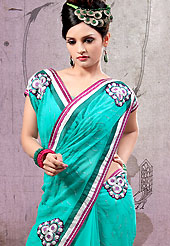 The evolution of style species collection spells pure femininity. This aqua chiffon saree is nicely designed with embroidered and patch work in fabulous style. Embroidery is done with resham, sequins and zari work in form of floral motifs. Beautiful embroidery work on saree make attractive to impress all. Matching blouse is available with this saree. Slight color variations are possible due to differing screen and photograph resolution.