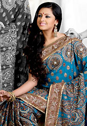 Exquisite combination of color, fabric can be seen here. This sky blue crepe saree is nicely designed with embroidered and silk patch work in fabulous style. Embroidery is done with zari, sequins, stone, cutdana, kasab and cut motti work in form of floral and paisley motifs. Beautiful broad heavy embroidery patch border on saree make attractive to impress all. This saree gives you a modern and different look in fabulous style. Matching blouse is available with this saree. Slight color variations are possible due to differing screen and photograph resolution.