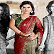 Maroon and Green Shimmer Faux Georgette Lehenga Style Saree with Blouse