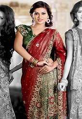 The glamorous silhouette to meet your most dire fashion needs. This maroon and green shimmer faux georgette lehenga style saree is nicely designed with embroidered and patch work in fabulous style. Embroidery is done with resham, zari, sequins, stone, cutdana, kasab and cut work in form of floral motifs. Beautiful embroidery work on saree make attractive to impress all. This saree gives you a modern and different look in fabulous style. Matching blouse is available with this saree. Slight color variations are possible due to differing screen and photograph resolution.