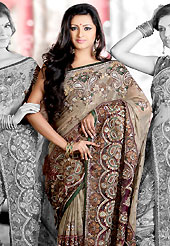 Elegance and innovation of designs crafted for you. This fawn and deep magenta half half shimmer faux georgette and net saree is nicely designed with embroidered and net patch work in fabulous style. Embroidery is done with resham, zari, sequins, stone, cutdana, kasab and cut moti work in form of floral motifs. Beautiful embroidery work on saree make attractive to impress all. This saree gives you a modern and different look in fabulous style. Matching blouse is available with this saree. Slight color variations are possible due to differing screen and photograph resolution.