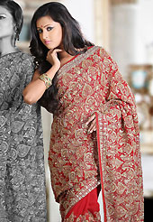 Outfit is a novel ways of getting yourself noticed. This red faux georgette saree is nicely designed with embroidered and patch work in fabulous style. Embroidery is done with resham, zari, sequins, stone, cutdana, beads, kasab and cut moti work in form of floral motifs. Beautiful embroidery work on saree make attractive to impress all. This saree gives you a modern and different look in fabulous style. Matching blouse is available with this saree. Slight color variations are possible due to differing screen and photograph resolution.