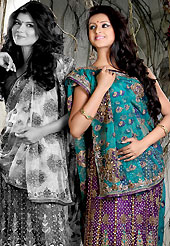 Bold colors created by the inventive drapes of textile catch the imagination like no other contemporary clothing. This turquoise blue and purple net lehenga style saree is nicely designed with embroidered and patch work in fabulous style. Embroidery is done with resham, zari, sequins, stone, cutdana, beads, kasab and cut moti work in form of floral motifs. Beautiful embroidery work on saree make attractive to impress all. This saree gives you a modern and different look in fabulous style. Matching blouse is available with this saree. Slight color variations are possible due to differing screen and photograph resolution.