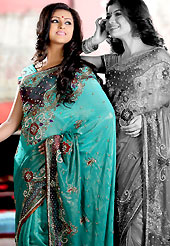 Era with extension in fashion, style, Grace and elegance have developed grand love affair with this ethnical wear. This shaded sea green shimmer faux georgette saree is nicely designed with embroidered and patch work in fabulous style. Embroidery is done with resham, zari, sequins, stone, cutdana, beads, kasab and cut moti work in form of floral motifs. Beautiful embroidery work on saree make attractive to impress all. This saree gives you a modern and different look in fabulous style. Matching blouse is available with this saree. Slight color variations are possible due to differing screen and photograph resolution.