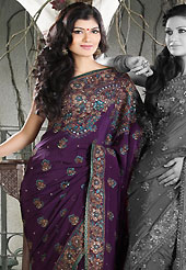 The popularity of this dress comes from the fact that it showcases the beauty modesty as well as exquisitely. This deep purple crepe saree is nicely designed with embroidered and patch work in fabulous style. Embroidery is done with resham, zari, sequins, stone, kasab and cutdana work in form of floral motifs. Beautiful embroidery work on saree make attractive to impress all. This saree gives you a modern and different look in fabulous style. Matching blouse is available with this saree. Slight color variations are possible due to differing screen and photograph resolution.