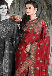 The very silhouette and styling of this outfit proves quiet flattering for most body types and renders a rather grand and majestic appeal. This maroon crepe saree is nicely designed with embroidered and patch work in fabulous style. Embroidery is done with resham, zari, sequins, stone, kasab and cutdana work in form of floral motifs. Beautiful embroidery work on saree make attractive to impress all. This saree gives you a modern and different look in fabulous style. Matching blouse is available with this saree. Slight color variations are possible due to differing screen and photograph resolution.