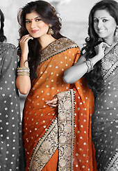 Different colors are a perfect blend of traditional Indian heritage and contemporary artwork. This shaded rust faux georgette saree is nicely designed with embroidered and silk patch work in fabulous style. Embroidery is done with zari, sequins, stone, kasab and cutdana work in form of floral motifs. Beautiful broad embroidery patch border on saree make attractive to impress all. This saree gives you a modern and different look in fabulous style. Matching blouse is available with this saree. Slight color variations are possible due to differing screen and photograph resolution.