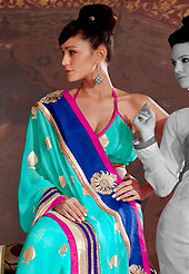 Take a look on the changing fashion of the season. This aqua blue georgette saree is nicely designed with embroidered patch work in fabulous style. Embroidery is done with foil print, zari, kasab and stone work in form of floral motifs. Beautiful embroidery patch border on saree make attractive to impress all. This saree gives you a modern and different look in fabulous style. Matching blouse is available with this saree. Slight color variations are possible due to differing screen and photograph resolution.