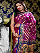 The very silhouette and styling of this outfit proves quiet flattering for most body types and renders a rather grand and majestic appeal. This awesomely designed embroidered work saree make you beautiful and trendy look. This saree is nicely embellished with self weaving, resham, zari and kasab work in wonderful floral motifs. Beautiful embroidery work and patch border on saree make different to others and gives a complete look. Color blend of this saree is nice.  This saree is made with banarasi brocade fabric. Contrasting green art silk blouse is available. Slight color variations are possible due to differing screen and photograph resolution.