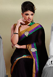 Welcome to the new era of Indian fashion wear. This black crepe saree is nicely designed with embroidered patch work in fabulous style. Embroidery is done with resham, zari and sequins work in form of floral motifs. Contrast patch border on saree make attractive to impress all. This saree gives you a modern and different look in fabulous style. Matching blouse is available with this saree. Slight color variations are possible due to differing screen and photograph resolution.