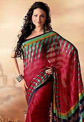 A desire that evokes a sense of belonging with a striking details. This maroon and green faux georgette saree is simply designed with abstract and geometric print work in fabulous style. This beautiful saree is used for casual porpose which gives you a singular and dissimilar look. Color blend of this saree is nice. Matching blouse is available with this saree. Slight color variations possible due to differing screen and photograph resolution.