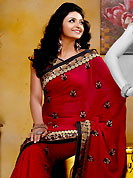 It is color this season and bright shaded suits are really something that is totally in vogue. This maroon jacquard saree is nicely designed with embroidered and silk patch work is done with resham, sequins, kasab and cut moti work in form of floral motifs. Embroidery work is highlighting the beauty of the saree. Saree gives you a singular and dissimilar look. Matching blouse is available. Slight color variations are possible due to differing screen and photograph resolution.
