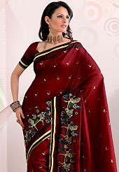 The traditional patterns used on this saree maintain the ethnic look. This maroon raw silk saree have beautiful embroidery patch work which is embellished with resham work. Fabulous designed embroidery gives you an ethnic look and increasing your beauty. Matching blouse is available. Slight Color variations are possible due to differing screen and photograph resolutions.