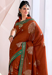 Exquisite combination of color, fabric can be seen here. This rust raw silk saree have beautiful embroidery patch work which is embellished with resham work. Fabulous designed embroidery gives you an ethnic look and increasing your beauty. Matching blouse is available. Slight Color variations are possible due to differing screen and photograph resolutions.