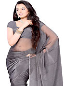 Elegance and innovation of designs crafted for you. Deep grey tissue shimmer saree. This saree gives you a modern and different look in fabulous style. Matching blouse is available. Slight Color variations are possible due to differing screen and photograph resolutions.