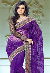 Exquisite combination of color, fabric can be seen here. This violet tissue saree is nicely designed with embroidery and patch border is done with resham and zari work. Saree gives you a singular and dissimilar look. Contrasting black blouse is available. Slight color variations are possible due to differing screen and photograph resolution.