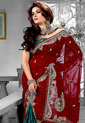 Style and trend will be at the peak of your beauty when you adorn this saree. This maroon and turquoise green faux georgette lehenga style saree have beautiful embroidery patch work which is embellished with zari, sequins, stone, cutdana and cut motti work. Fabulous designed embroidery gives you an ethnic look and increasing your beauty. Matching blouse is available. Slight Color variations are possible due to differing screen and photograph resolutions.