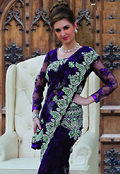 Style and trend will be at the peak of your beauty when you adorn this saree. This dark violet net saree have beautiful embroidery patch work which is embellished with stone work in floral motifs. Fabulous designed embroidery gives you an ethnic look and increasing your beauty. Matching blouse is available. This saree is also available in A Magenta, B Green, C Red colors. Slight Color variations are possible due to differing screen and photograph resolutions.
