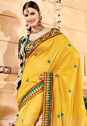 Exquisite combination of color, fabric can be seen here. This yellow banarasi silk saree have beautiful embroidery patch work which is embellished with resham work in floral motifs. Fabulous designed embroidery gives you an ethnic look and increasing your beauty. Contrasting green blouse is available. Slight Color variations are possible due to differing screen and photograph resolutions.
