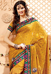 Outfit is a novel ways of getting yourself noticed. This mustard banarasi silk saree have beautiful embroidery patch work which is embellished with resham, zari, sequins and beads work. Fabulous designed embroidery gives you an ethnic look and increasing your beauty. Matching blouse is available. Slight Color variations are possible due to differing screen and photograph resolutions.