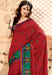 Dreamy variation on shape and forms compliment your style with tradition. This red banarasi silk saree have beautiful embroidery patch work which is embellished with resham work. Fabulous designed embroidery gives you an ethnic look and increasing your beauty. Contrasting green blouse is available. Slight Color variations are possible due to differing screen and photograph resolutions.