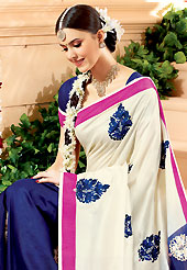 Welcome to the new era of Indian fashion wear. This off white and dark blue banarasi silk saree have beautiful embroidery patch work which is embellished with resham, zari and stone work. Fabulous designed embroidery gives you an ethnic look and increasing your beauty. Matching blouse is available. Slight Color variations are possible due to differing screen and photograph resolutions.