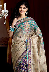 Exquisite combination of color, fabric can be seen here. This light fawn and dark purple jute silk saree is nicely designed with embroidered and brocede patch work is done with resham, kasab, cutdana, cut motti, sequins and stone work. Embroidery work is highlighting the beauty of the saree. Saree gives you a singular and dissimilar look. Matching blouse is available. Slight color variations are possible due to differing screen and photograph resolution.