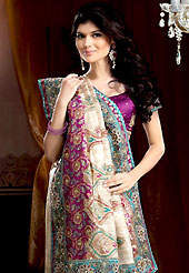 Different colors are a perfect blend of traditional Indian heritage and contemporary artwork. This beige and purple jute silk and brocade saree is nicely designed with embroidered and brocade patch work is done with resham, cutdana, pull motti, sequins and stone work. Embroidery work is highlighting the beauty of the saree. Saree gives you a singular and dissimilar look. Matching purple blouse is available. Slight color variations are possible due to differing screen and photograph resolution.