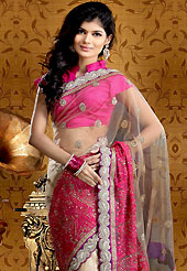 Get ready to sizzle all around you by sparkling saree. This fawn and pink net saree is nicely designed with embroidered and silk patch work is done with resham, kundan, cutdana, pull motti and stone work. Embroidery work is highlighting the beauty of the saree. Saree gives you a singular and dissimilar look. Matching pink blouse is available. Slight color variations are possible due to differing screen and photograph resolution.