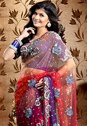 Era with extension in fashion, style, Grace and elegance have developed grand love affair with this ethnical wear. This orange, red and dark purple net saree is nicely designed with embroidered patch work is done with cutdana and stone work. Embroidery work is highlighting the beauty of the saree. Saree gives you a singular and dissimilar look. Matching dark purple blouse is available. Slight color variations are possible due to differing screen and photograph resolution.