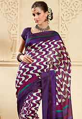 Make a trendy look with this classic printed saree. This violet, off white and dark pink art silk saree is simply designed with floral, wave and stripe print work. This beautiful saree is used for casual porpose which gives you a singular and dissimilar look. Color blend of this saree is nice. Matching violet blouse is available with this saree. Slight color variations possible due to differing screen and photograph resolution.