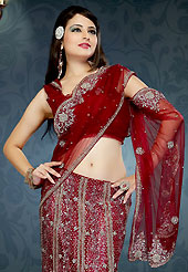 The fascinating beautiful subtly garment with lovely patterns. This maroon and cream net and georgette lehenga style saree is nicely designed with embroidered patch work is done with sequins and cutdana work. This saree gives you a modern and different look in fabulous style. Matching blouse is available with this saree. Slight color variations are possible due to differing screen and photograph resolution.
