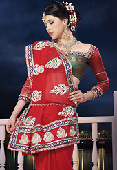The most beautiful refinements for style and tradition. This red satin chiffon saree is nicely designed with embroidered and patch border work is done with resham, zari, stone and lace work. Saree gives you a singular and dissimilar look. Contrasting green brocade blouse is available. Slight color variations are possible due to differing screen and photograph resolution.