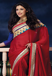The traditional patterns used on this saree maintain the ethnic look. This dark red satin chiffon saree is nicely designed with embroidered and patch border work is done with zari, stone and lace work. Saree gives you a singular and dissimilar look. Contrasting blue dupion blouse is available. Slight color variations are possible due to differing screen and photograph resolution.
