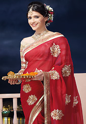 Make a trendy look with this classic embroidered saree. This red chiffon saree is nicely designed with embroidered and patch border work is done with zari and lace work. Saree gives you a singular and dissimilar look. Contrasting beige brocade blouse is available. Slight color variations are possible due to differing screen and photograph resolution.