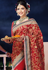 Breathtaking collection of sarees with stylish embroidery work and fabulous style. This red chiffon saree is nicely designed with embroidered and patch border work is done with zari, stone and lace work. Saree gives you a singular and dissimilar look. Contrasting green and red brocade blouse is available. Slight color variations are possible due to differing screen and photograph resolution.