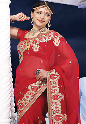 An endearing splash oh colors look gorgeous tridimensional charm. This red chiffon saree is nicely designed with embroidered and patch border work is done with resham, zari, stone and lace work. Saree gives you a singular and dissimilar look. Matching blouse is available. Slight color variations are possible due to differing screen and photograph resolution.