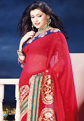 Keep the interest with this designer embroidery saree. This red chiffon saree is nicely designed with embroidered and patch border work is done with zari, stone and lace work. Saree gives you a singular and dissimilar look. Matching dupion blouse is available. Slight color variations are possible due to differing screen and photograph resolution.