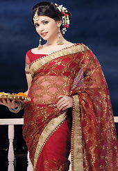 Take the fashion industry by storm in this beautiful embroidered saree. This red net saree is nicely designed with embroidered and patch border work is done with zari work. Saree gives you a singular and dissimilar look. Matching blouse is available. Slight color variations are possible due to differing screen and photograph resolution.