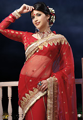 Outfit is a novel ways of getting yourself noticed. This red half half net and chiffon saree is nicely designed with embroidered and patch border work is done with zari, stone and lace work. Saree gives you a singular and dissimilar look. Matching viscose blouse is available. Slight color variations are possible due to differing screen and photograph resolution.