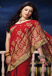 Attract all attentions with this embroidered saree. This red chiffon saree is nicely designed with embroidered and patch border work is done with zari, stone and lace work. Saree gives you a singular and dissimilar look. Matching blouse is available. Slight color variations are possible due to differing screen and photograph resolution.